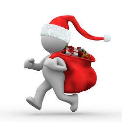 Clay figurine dressed as Santa and carrying a sack of toys