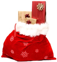 Santa's gift bag with a few wrapped gifts peeking out the top