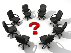 office chairs in a circle with a question mark in the middle