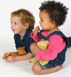 preschool children holding stuffed animals