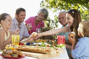 family eating a picnic lunch